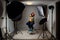 Photographing children in professional photo studio withÂ lighting equipment